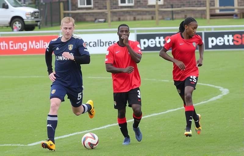 North East United FC players during a match North East United FC players in action with North East United FC watermark